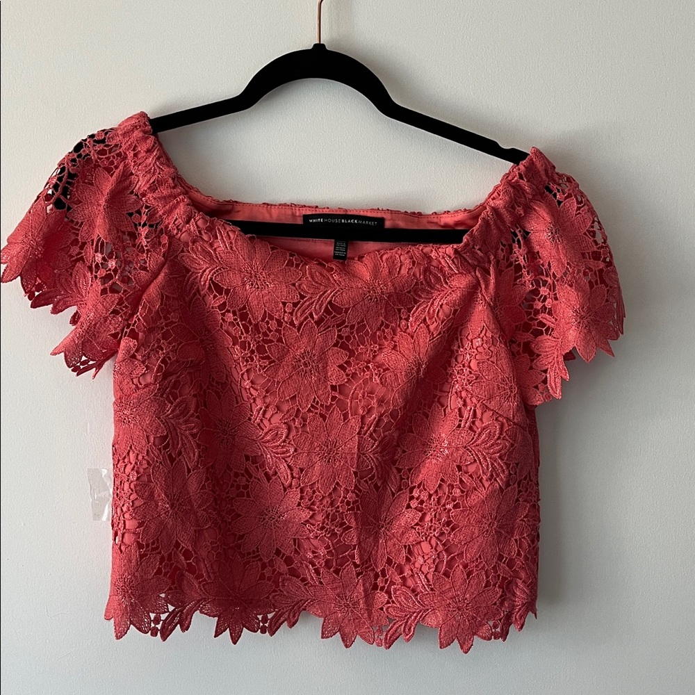 White House Black Market Coral Lace Top off shoulder.
Size US 0
New
